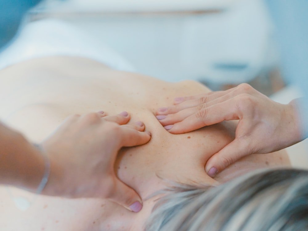 A therapist providing hands-on physical treatment