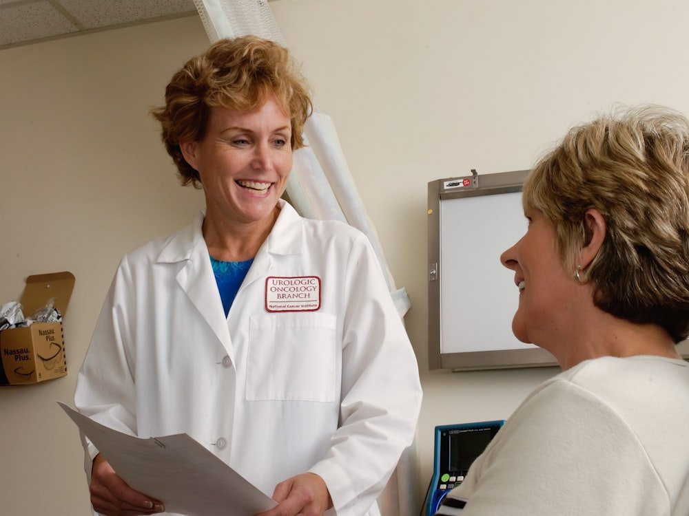 A clinician in conversation with a patient